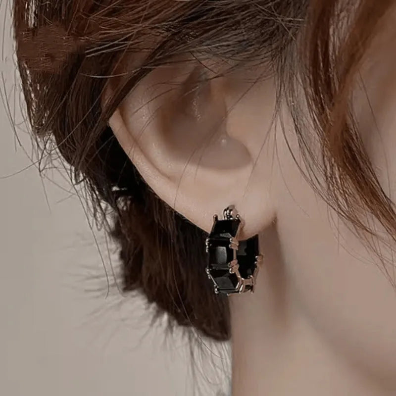Geometric U-shaped women's earrings with round zircon crystals in gold plating