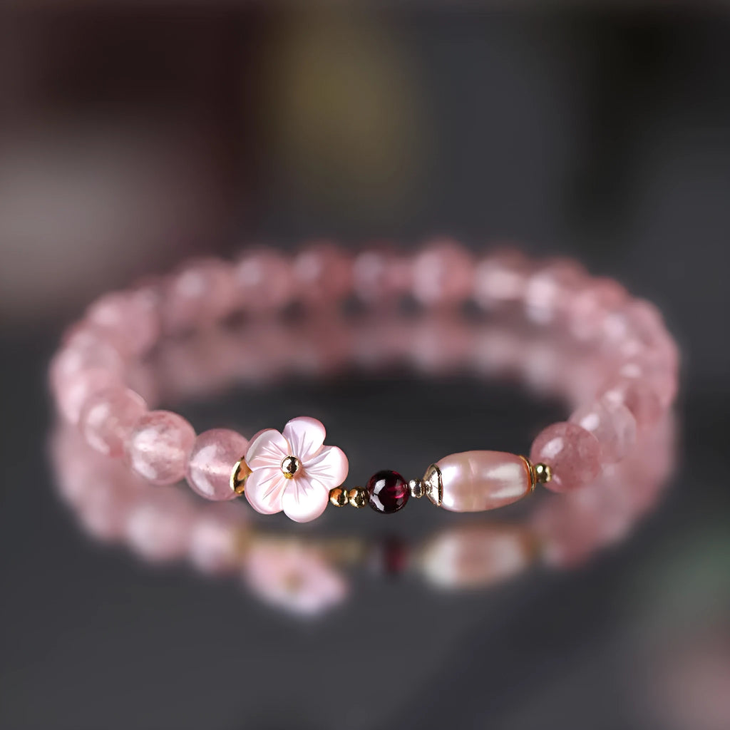 Crystal floral bracelet with strawberry quartz peach blossom colour on wrist