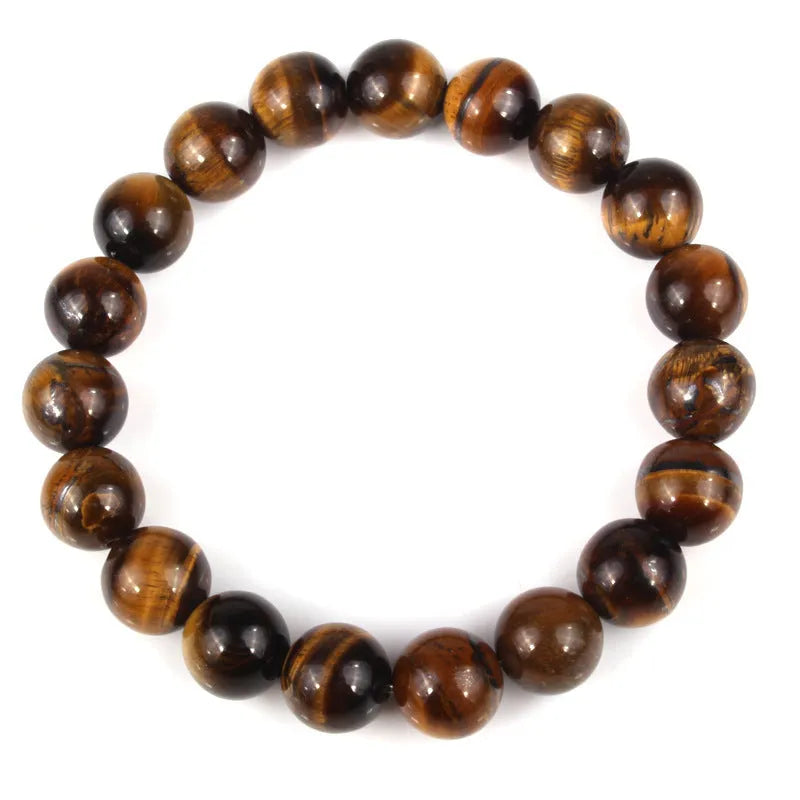 Natural tigereye crystal beaded bracelet with round beads, shown in a selection of colours and sizes on a wrist.