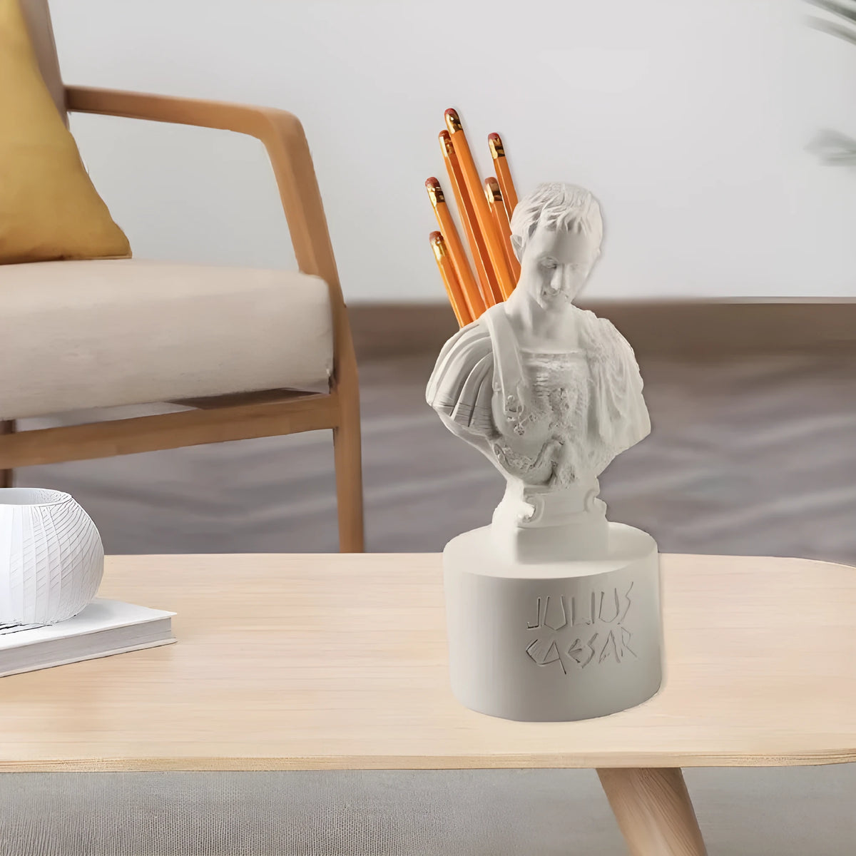 White American style character model pen holder made from synthetic resin on a desk.