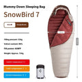 Mummy style goose down sleeping bag for adults shown with its storage bag