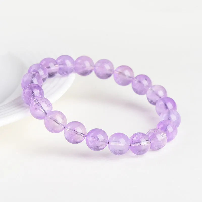 Lavender amethyst crystal bracelet with round beads showing water ripple design in light purple colour