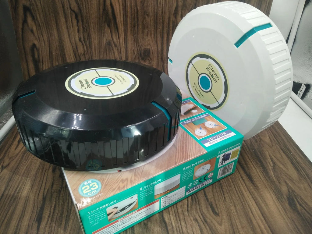 Black or white AC robot vacuum cleaner on a wooden floor showing its 23-inch square size and low profile.