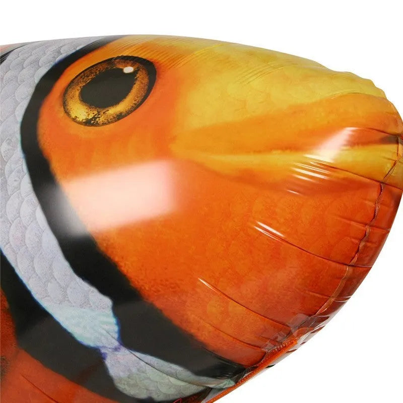 Large remote control shark helium balloon flying indoors with handheld infrared controller.