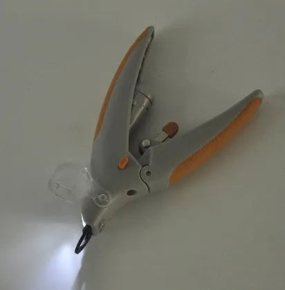Dog nail clipper with LED light and imitation blood line guide, made from white ABS plastic