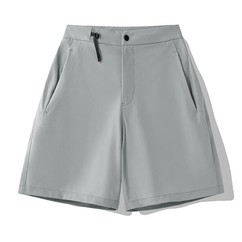 Men's khaki quick-drying sports shorts with 3D cut and elastic waistband laid flat.