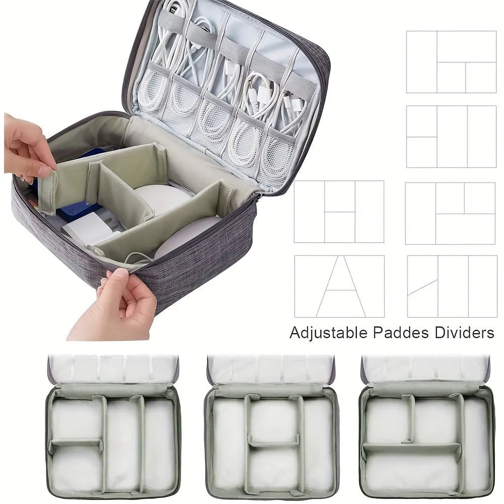 Black waterproof electronic cable organiser bag open to show mesh pockets, elastic loops, and removable padded dividers.