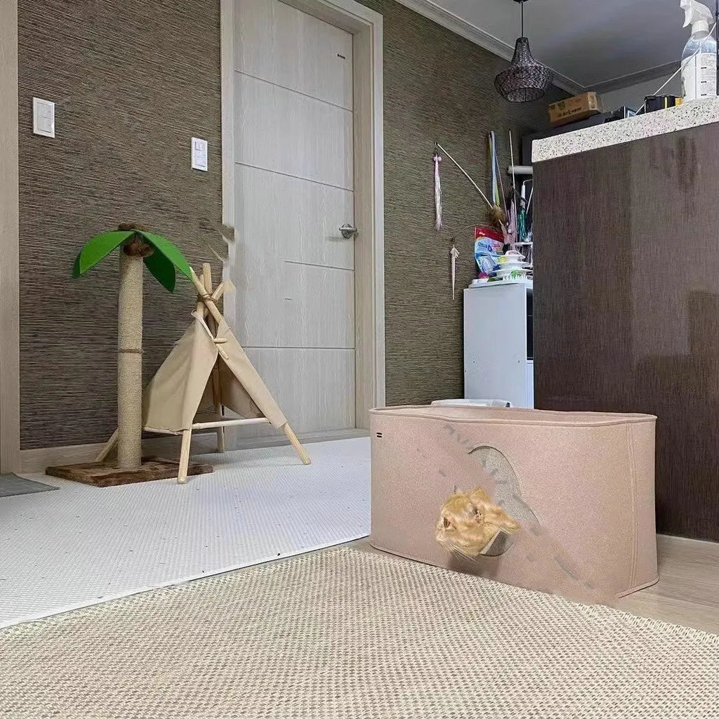 Foldable grey felt cat nest bed shown in a home setting next to a cat.