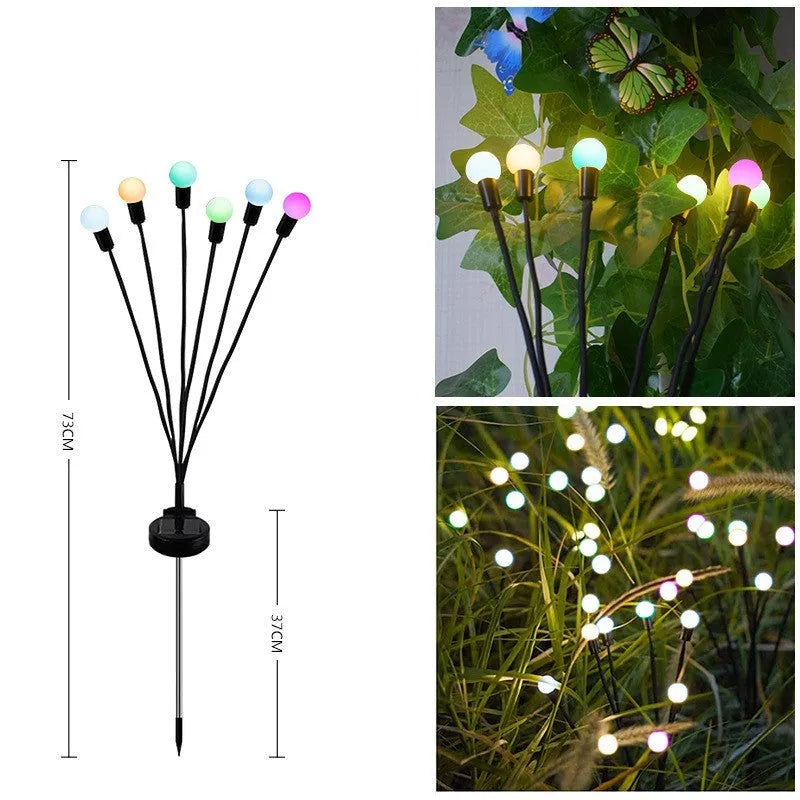 Solar-powered LED ground lamp with multiple heads inserted in garden soil alongside pathway