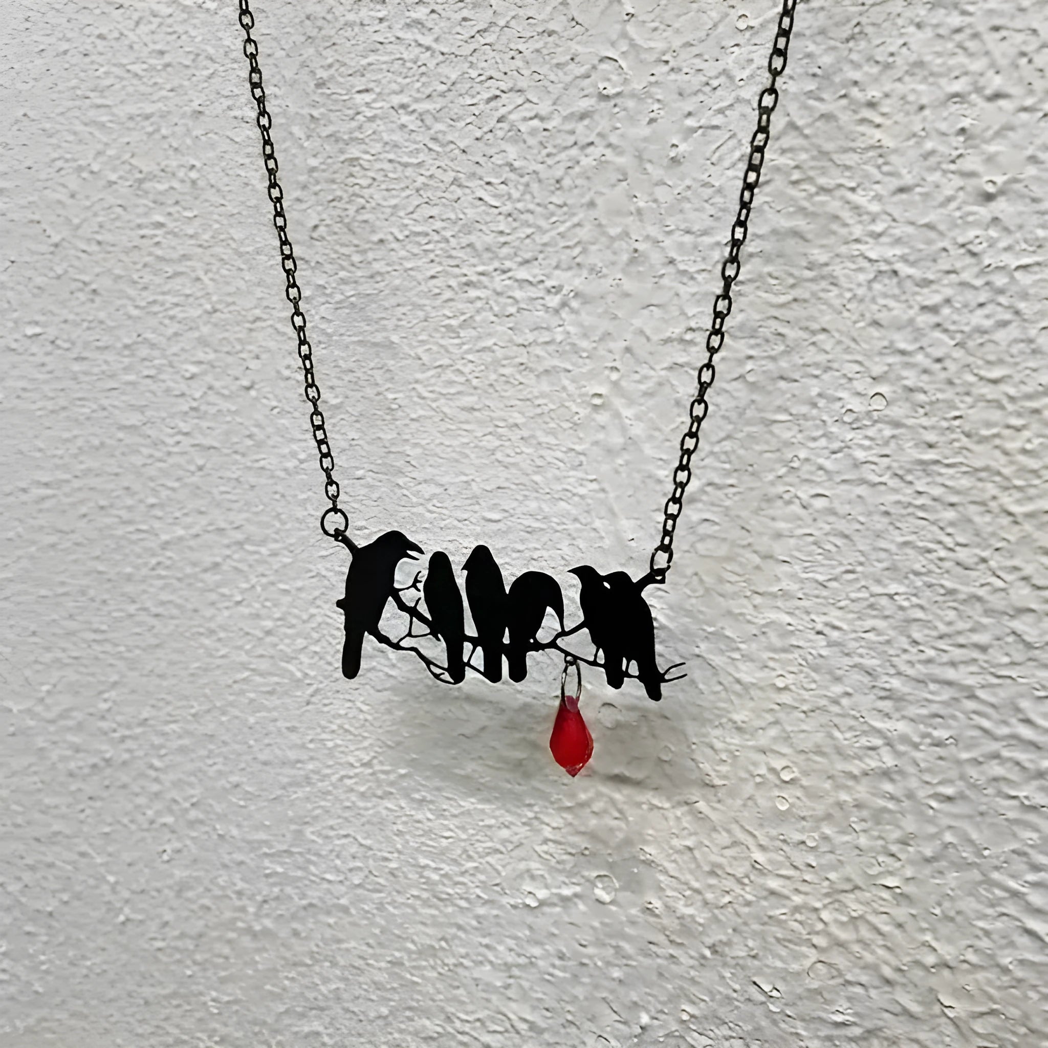 Black electroplated alloy crow necklace with cross chain closure for gothic fashion