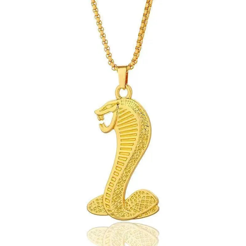 Gold tone geometric pendant necklace with zircon stone inlay and diamond cut finish