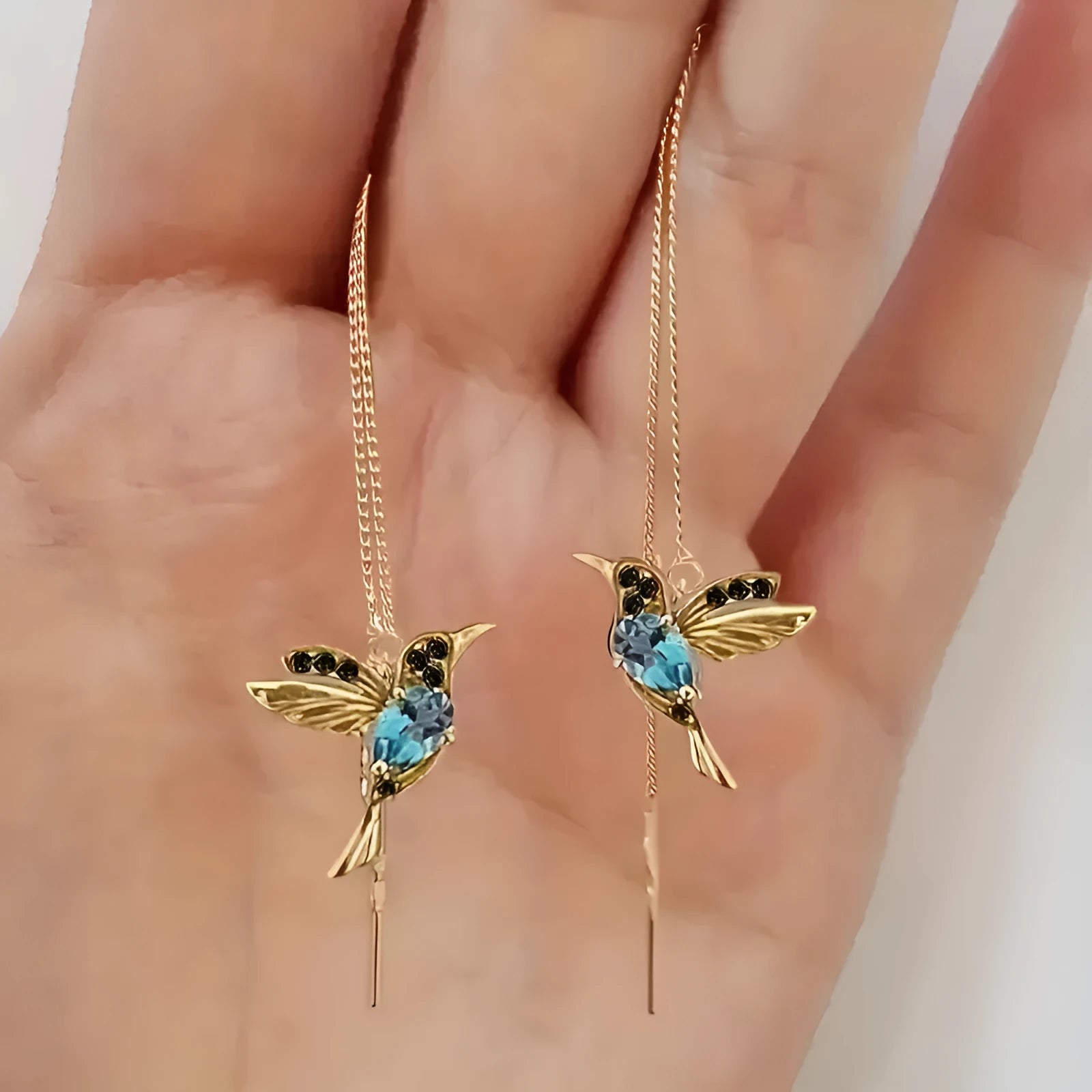 Long style bird hanging earrings with mixed zirconium wings in electroplated alloy construction