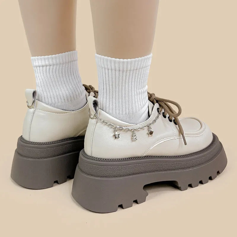 Amy And Mai white platform Mary Jane shoes with chunky 6-8cm heel and front lace-up.