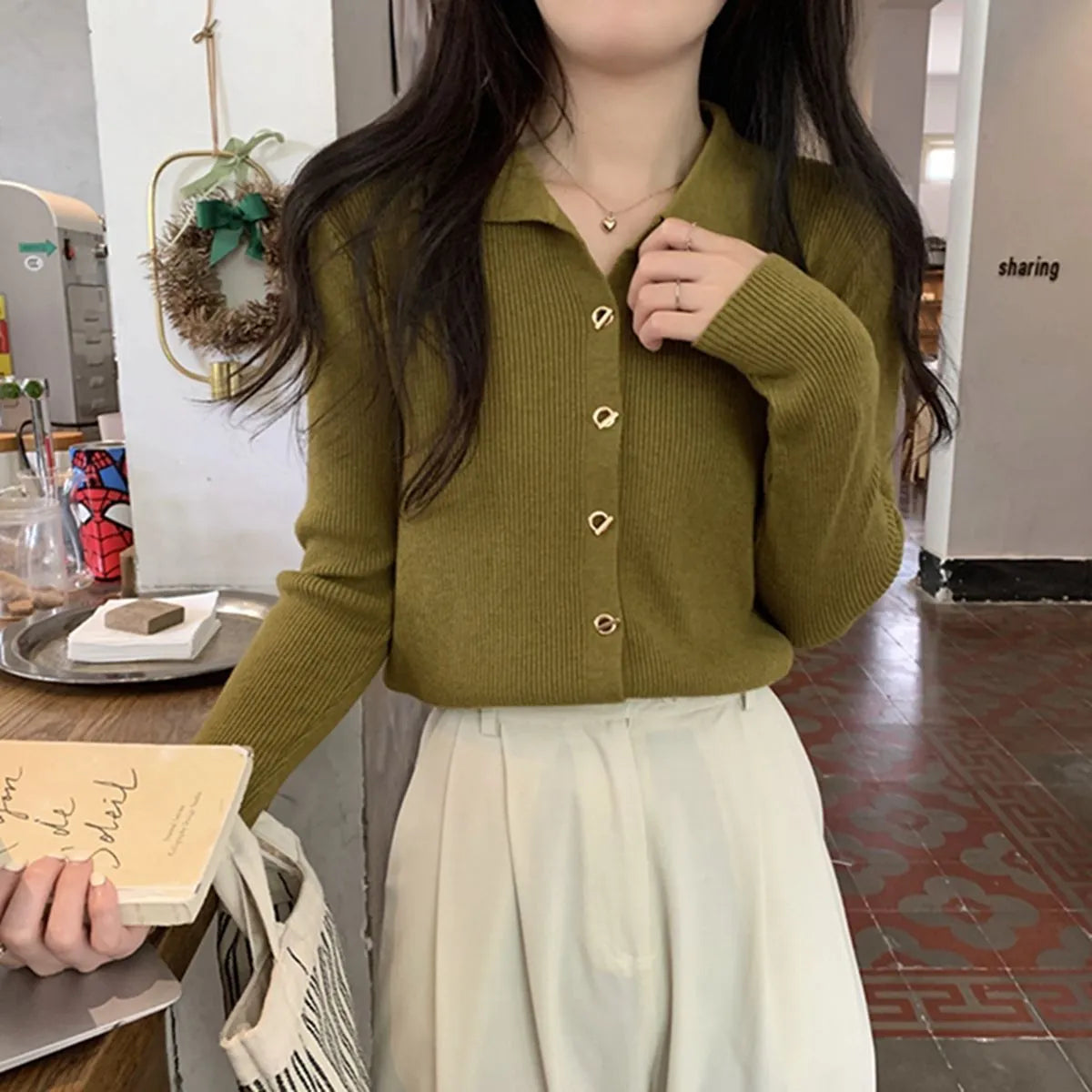 Beige viscose knitted long-sleeved cardigan with loose fit design on hanger