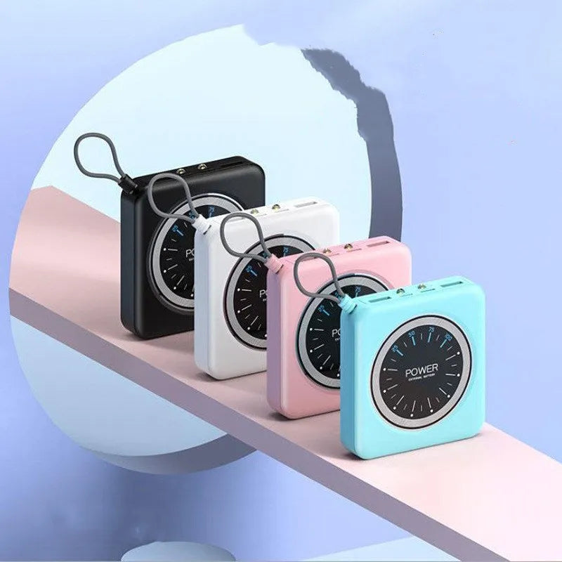Mini clock charger portable power bank in mint green colour showing compact design with USB ports
