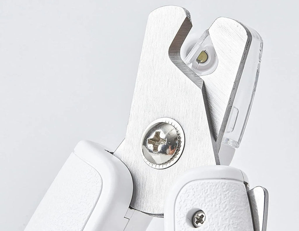 White pet nail clippers with LED light, anti-splash guard, and leather-like handle.