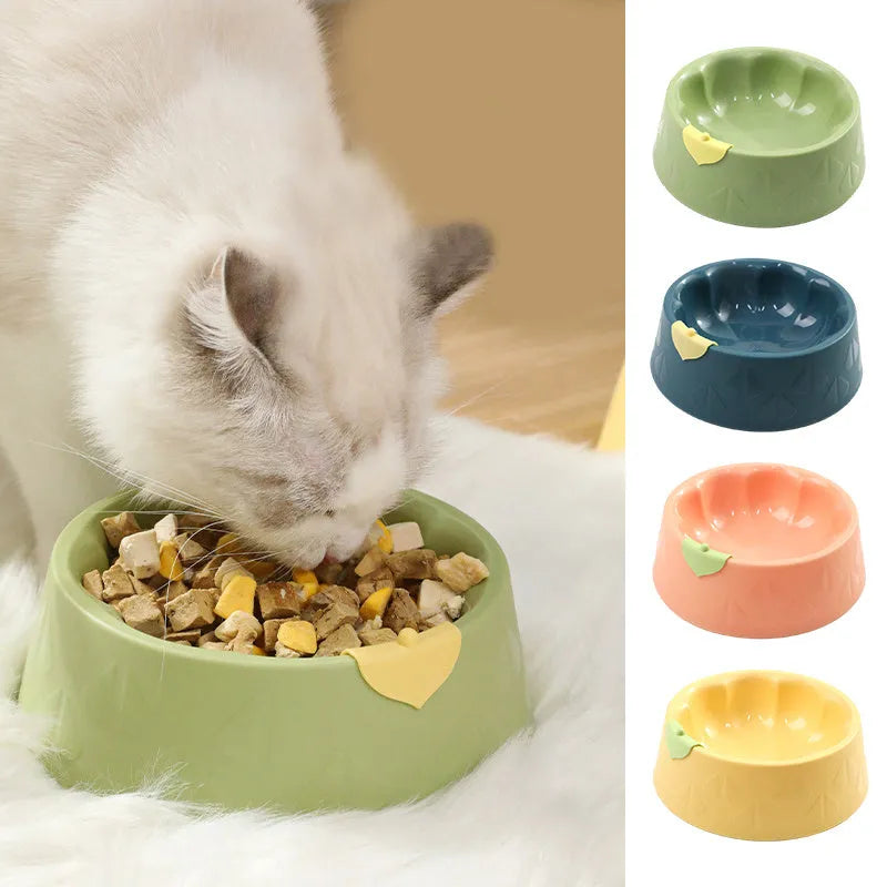 Green plastic pet bowl with dual compartments for food and water, anti-tipping design