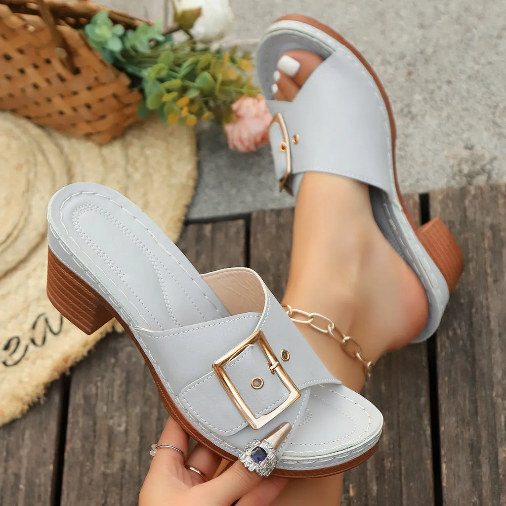 Women's black chunky heel slippers with metal buckle and round toe