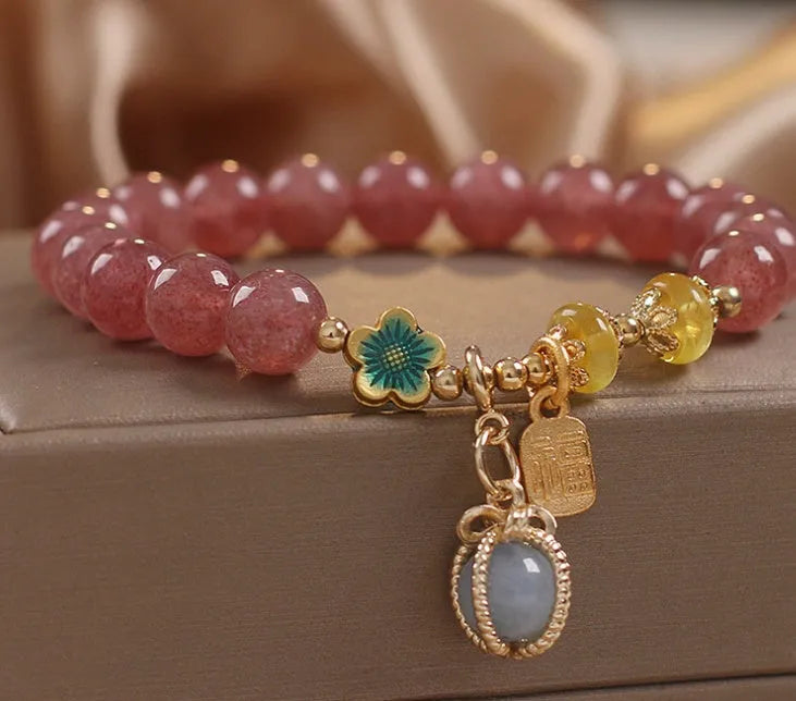Red women's bracelet with strawberry quartz beads, alloy settings, and sparkling rhinestone details.