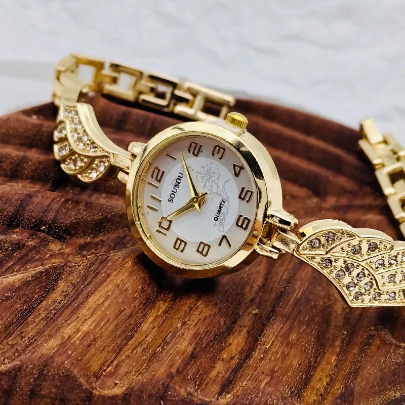 Women's stainless steel watch with round dial and Vachette clasp, shown in gold colour option.