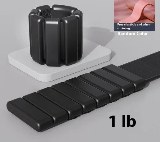 Velcro silicone fitness bracelet with detachable weight in black, blue, gray, or pink.