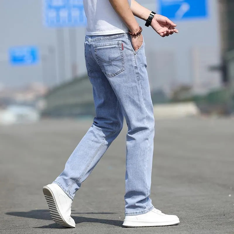 Men's straight leg jeans in smoky gray colour with low waist and zipper fly closure