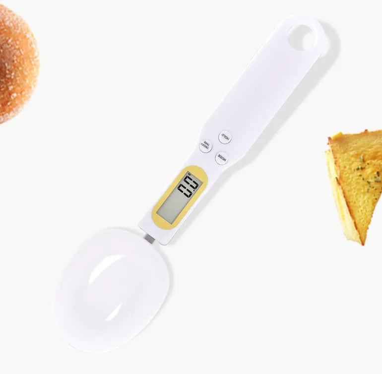 Black digital measuring spoon scale showing weight on display, with spoon bowl for holding materials.