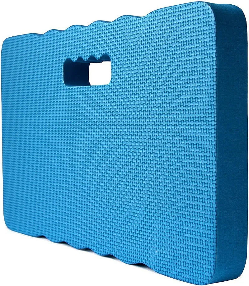 Blue Eva foam garden kneeler pad with handles and side pockets on grass.