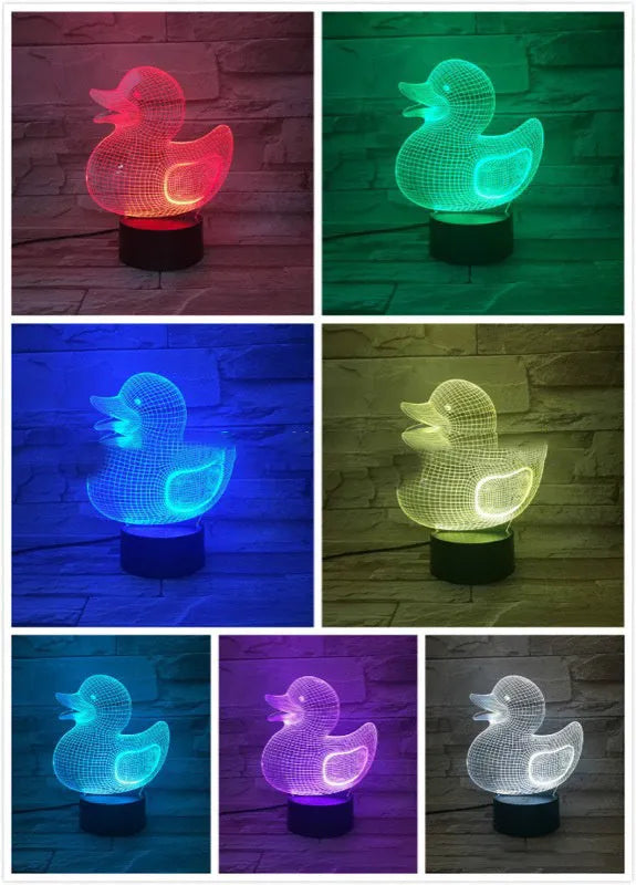 Little Yellow Duck 3D LED night light on a table showing its colourful illuminated display and remote control.