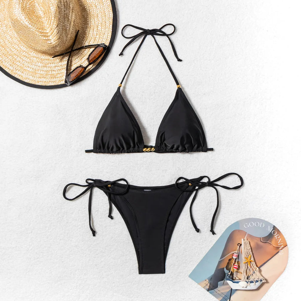 Black women's bikini swimsuit with metal bead split design on polyester fabric
