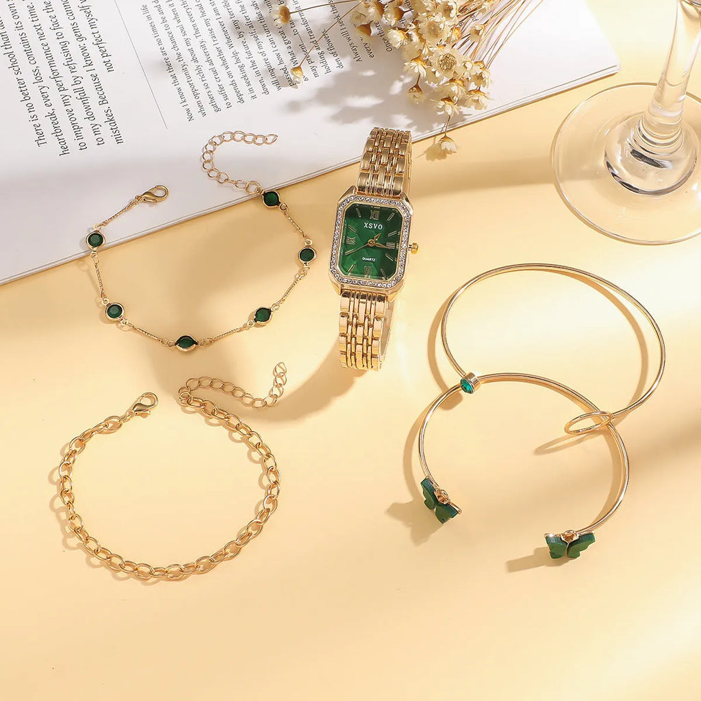Gold green square watch with alloy case and four matching bracelets laid out showing jewellery buckle and spiral crown