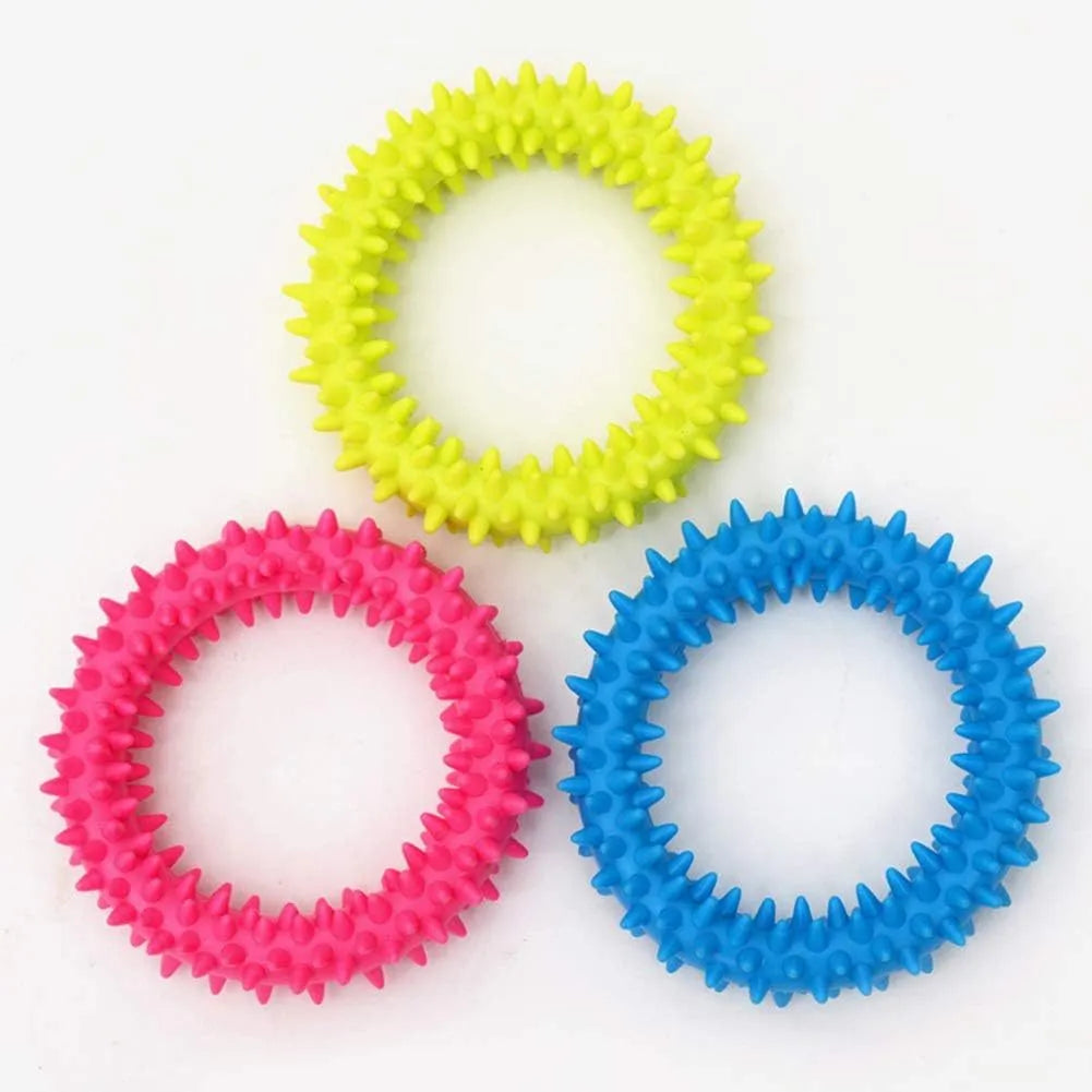 Blue TPR spiky circle ring dog chew toy for dental cleaning on a white background.