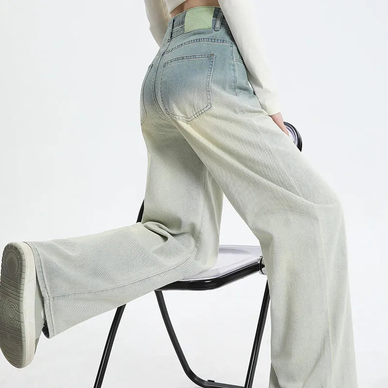 Women's gradient blue straight-leg denim trousers with wide-leg style on hanger