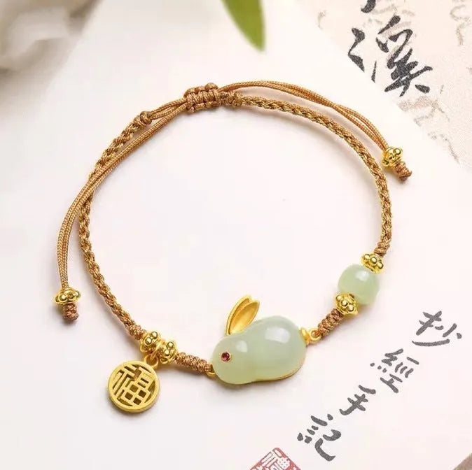 Hetian jade rabbit charm bracelet for women on a yellow string fastening