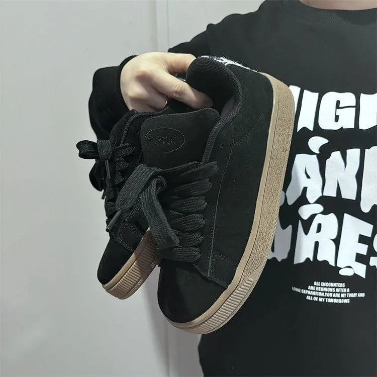 Black retro low-top sneakers with waterproof platform soles and round toe design