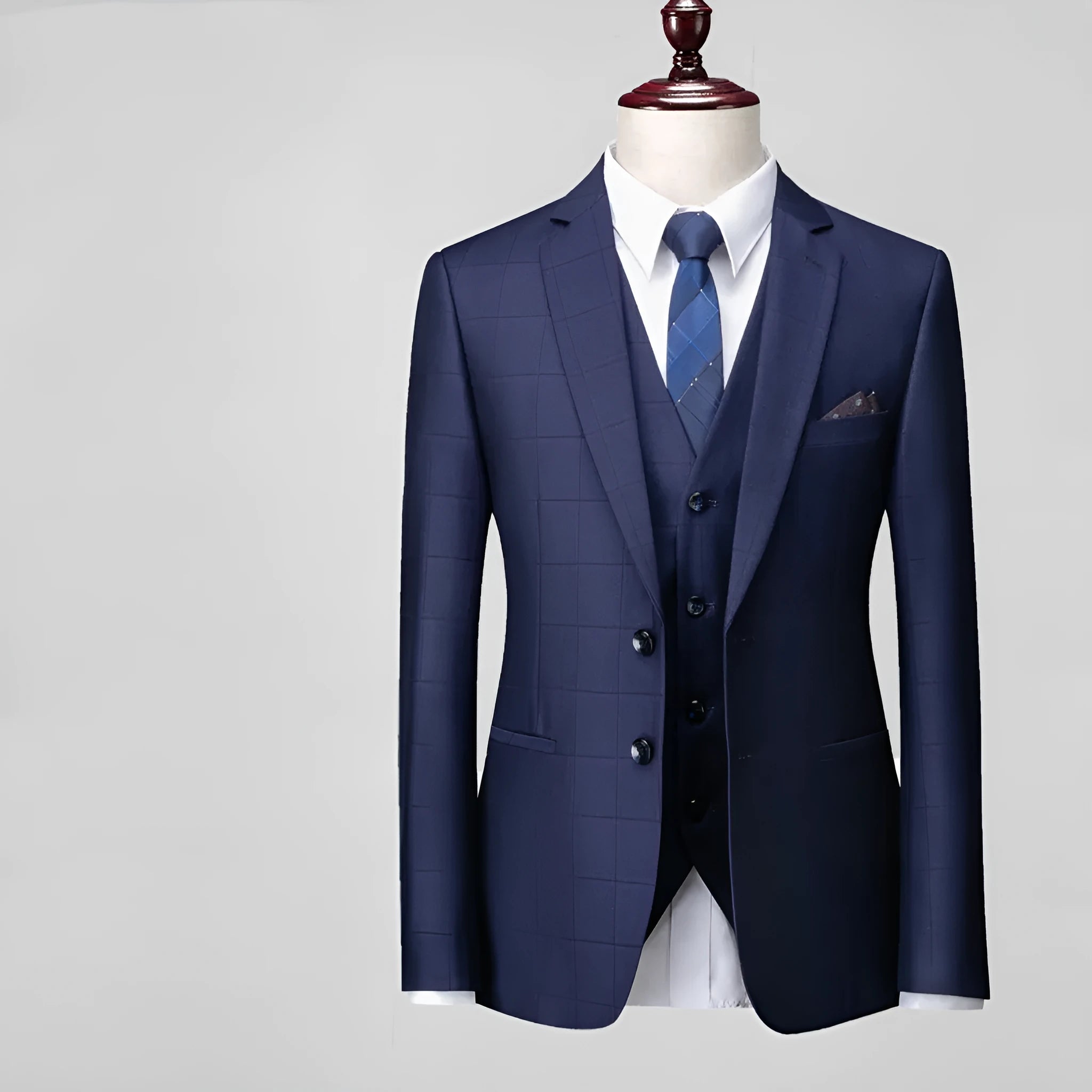 Men's navy blue slim fit three-piece suit with vest on hanger