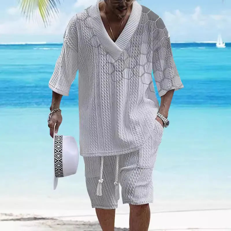 Men's grey printed knitted shorts suit with drop-shoulder short-sleeved top on a hanger.