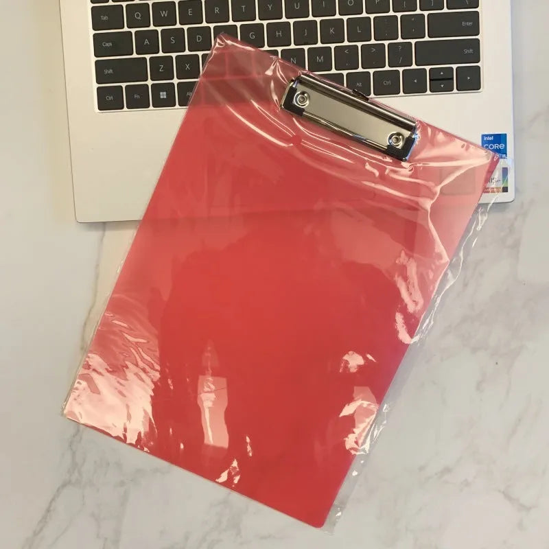 Transparent A4 clipboard with metal flat clip holding paper, shown in blue colour option.