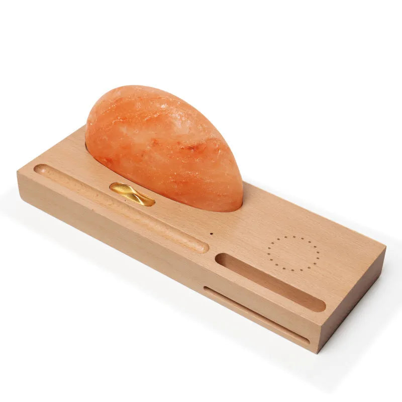 Sunrise Oriental wooden base salt lamp with wireless phone charging pad on top.