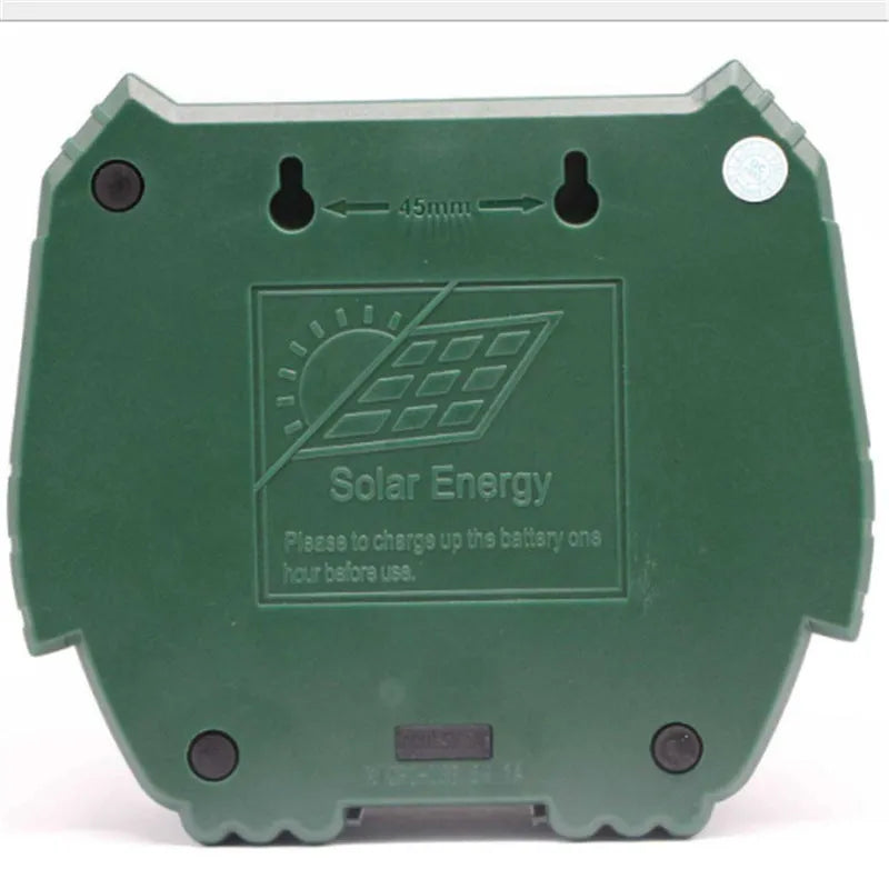 Green solar-powered ultrasonic animal repeller unit with solar panel on top
