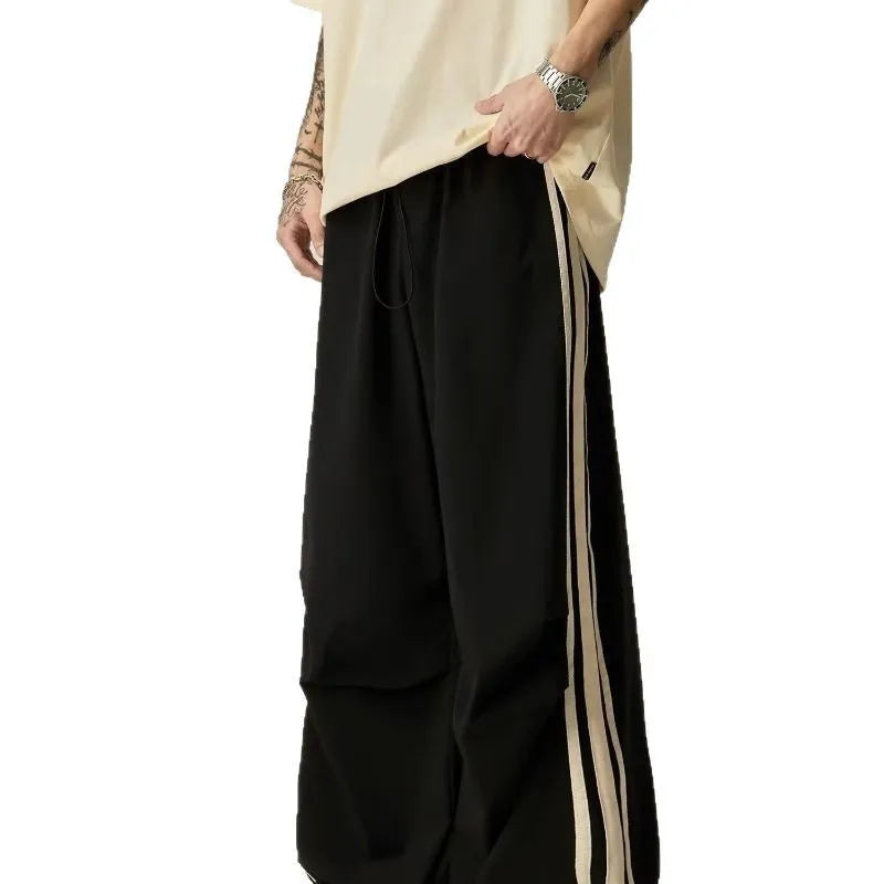 Men's black wide leg climbing trousers with high waist and straight leg design on mannequin