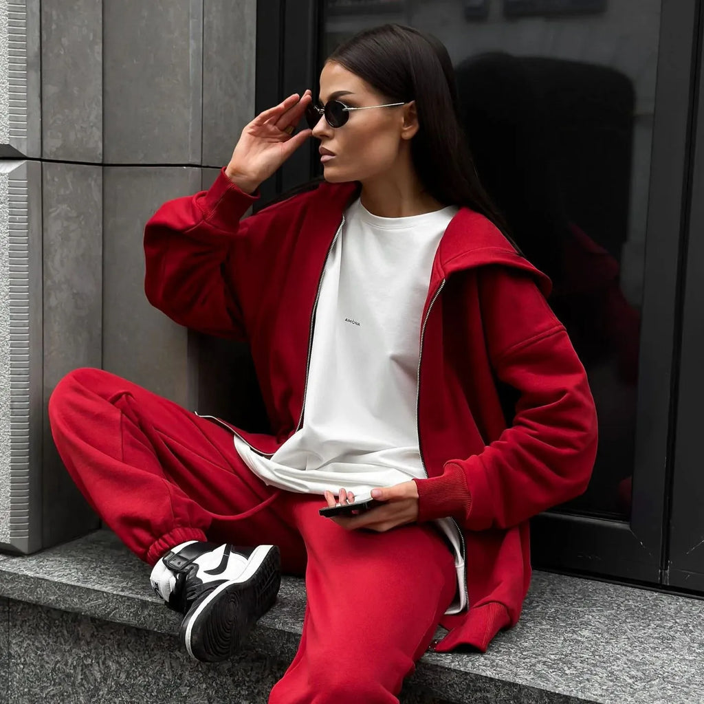 Red street style two-piece set with long-sleeved coat and trousers on clothing rack