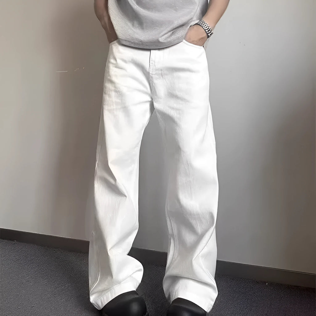 Men's white straight-leg cotton denim jeans on a plain background.