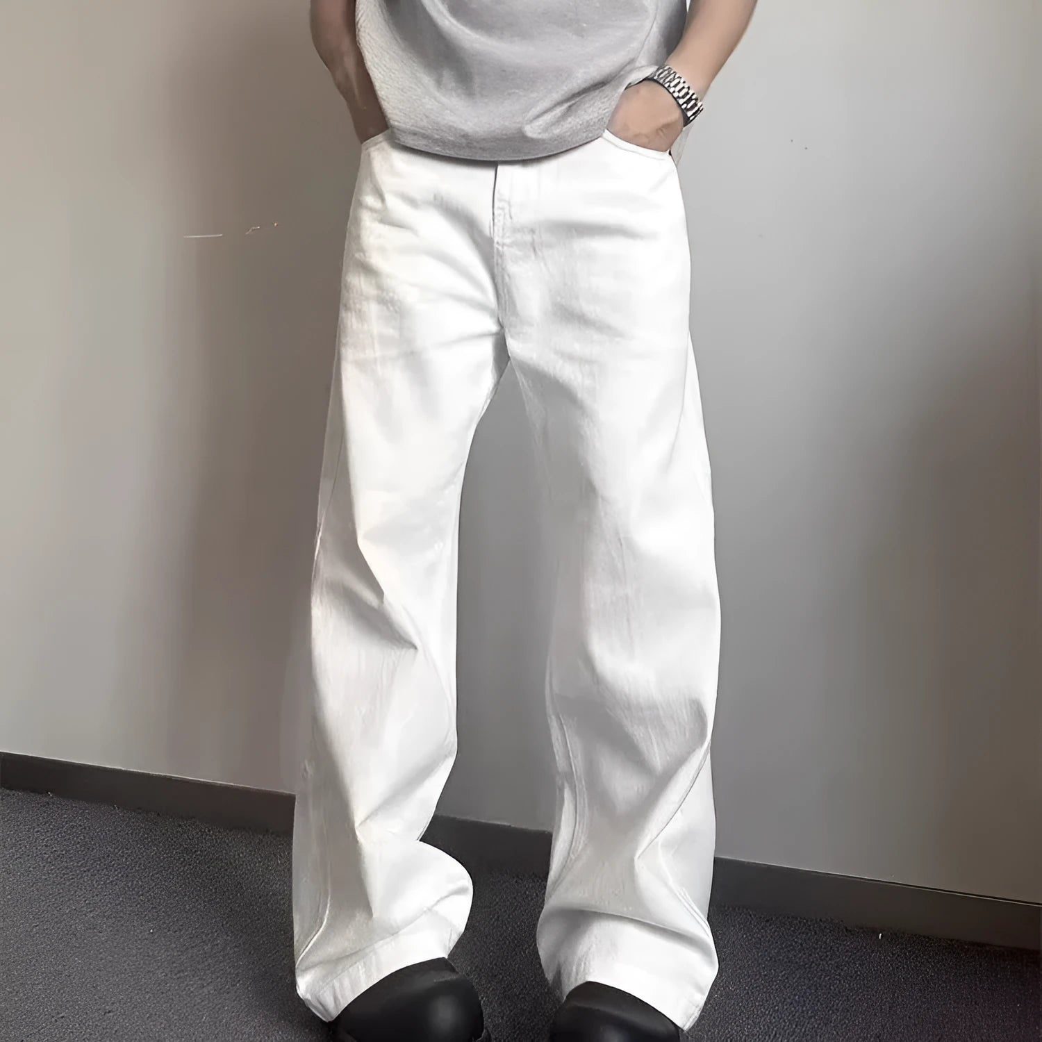 Men's white straight-leg cotton denim jeans on a plain background.