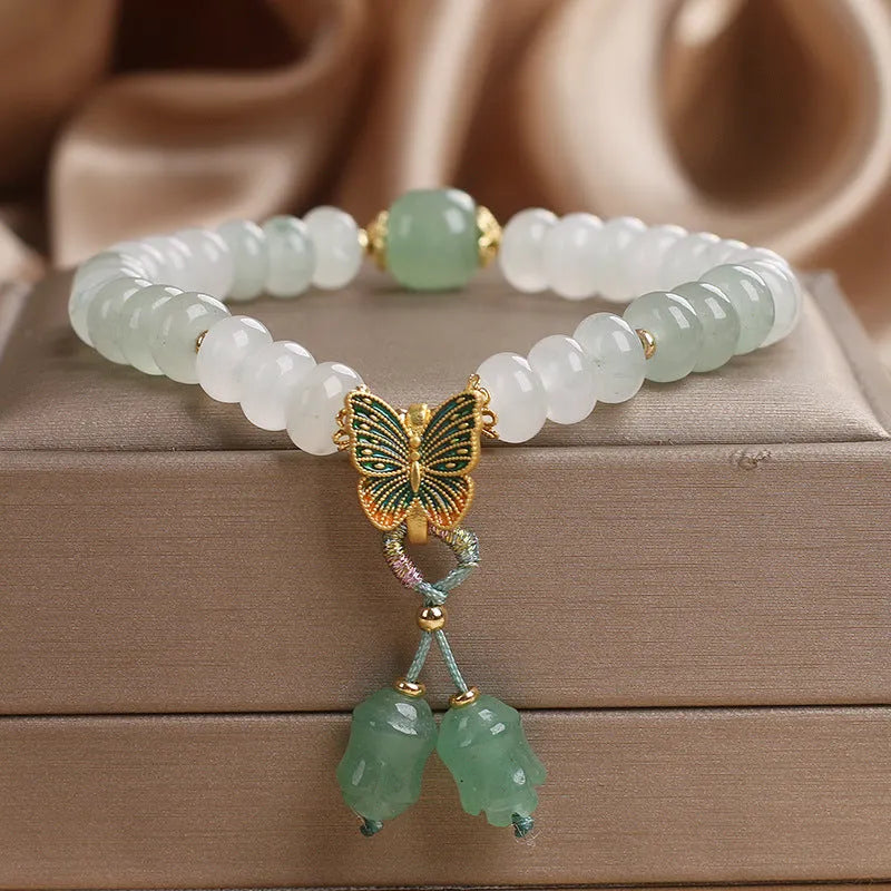 Green Tian Shan Cui abacus beads jade bracelet with butterfly tassel and pearl accents