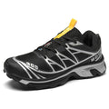 Men's and women's low-top hiking shoes in khaki colour with round toe and lace-up front.