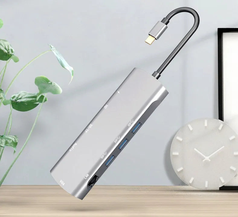 Grey aluminium USB-C docking station with HDMI, VGA, USB 3.0, and PD charging ports