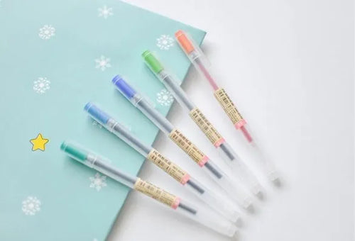 Pack of twelve Muji gel pens with clear barrels and 0.5mm fine black ink nibs
