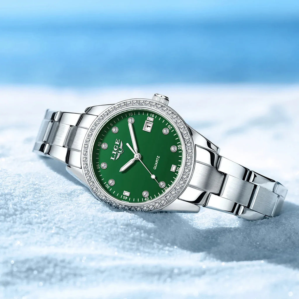 Women's silver quartz watch with diamond-encrusted bezel and luminous dial on stainless steel strap