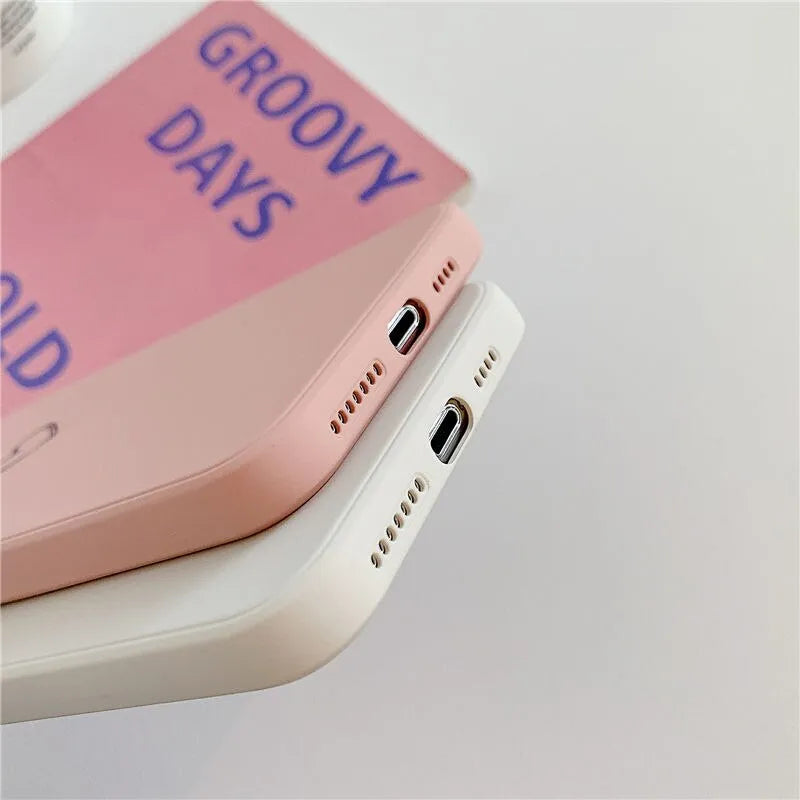Silicone TPU back cover case for Apple iPhone in various solid colours including black, pink, and green.